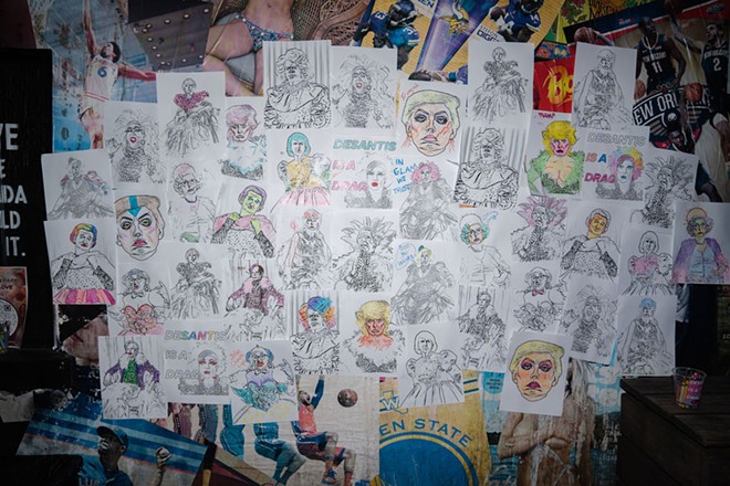 A wall in Orlando's Southern Nights nightclub adorned with coloring book pages from Corie Mattie/LA Hope Dealer for an art and drag show. Aug. 16, 2023. - Corie Mattie