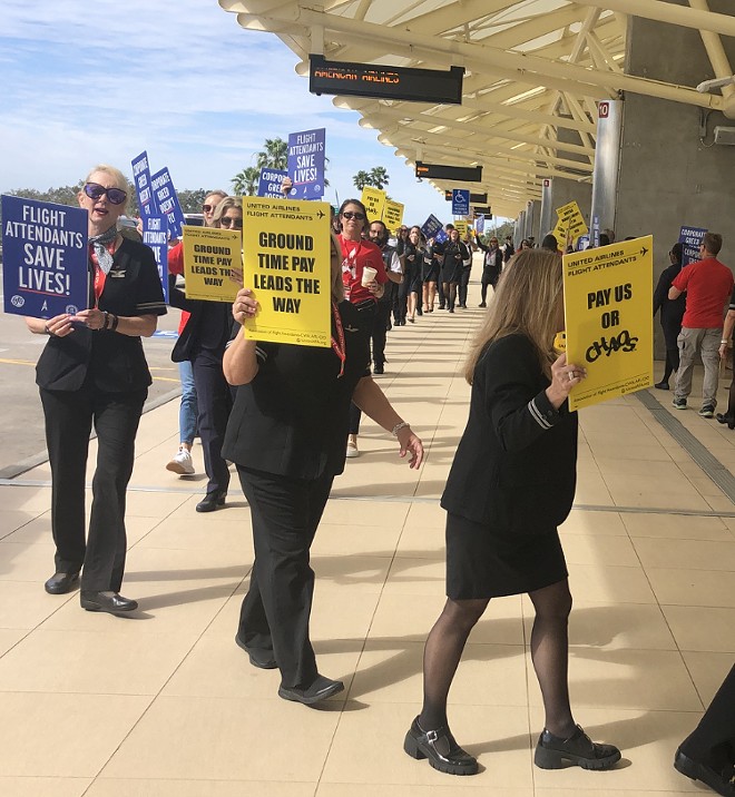 'Pay us or chaos': Union flight attendants for various airlines picket outside MCO (Feb. 13, 2024) - photo by McKenna Schueler