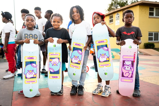 Kids at a Summer Night Lights event for L.A. communities affected by violence score free boards from sponsor Girl Skateboards (2022) - photo by Alex Crawford, courtesy of Skate Bud
