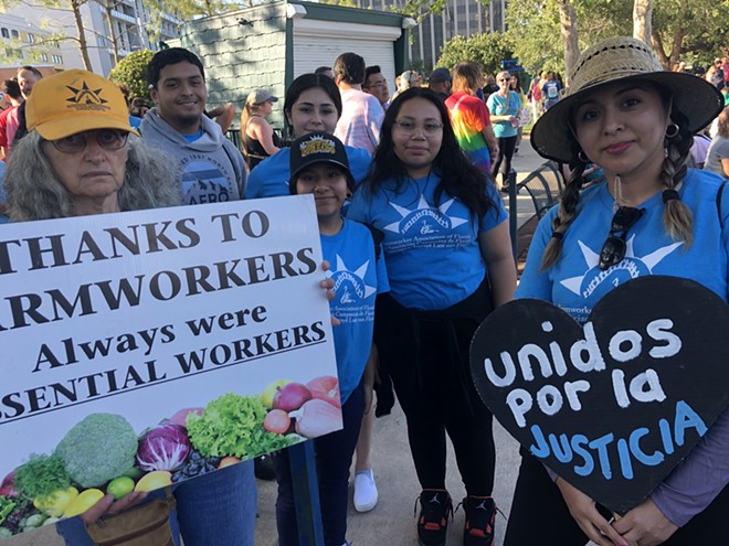 Organizers with the Farmworkers Association of Florida at the 'March for Our Dreams & Freedom' in downtown Orlando (May 1, 2023) - photo by McKenna Schueler
