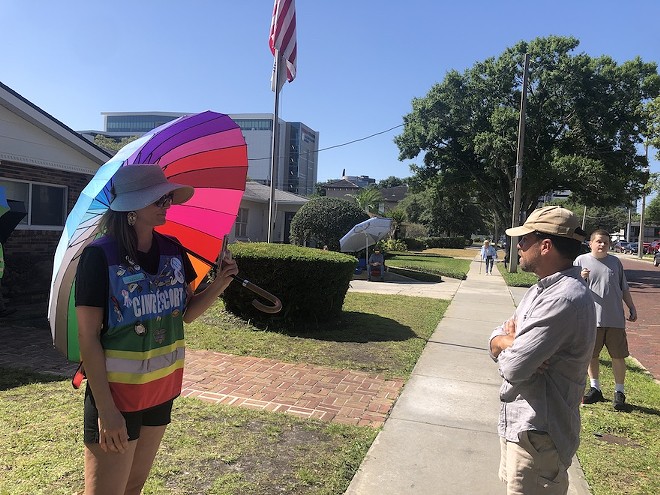 A clinic escort and an anti-abortion activist face off outside an Orlando abortion clinic. (May 1, 2024) - Photo by McKenna Schueler