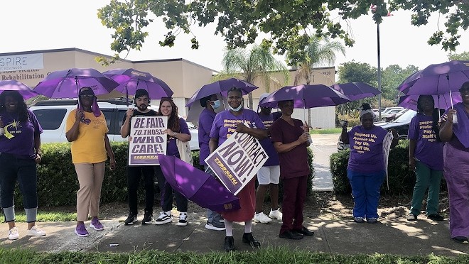 Nursing home staff and fellow 1199 SEIU union members picket outside Aspire at Rosewood in Orlando amid ongoing union contract talks (Aug. 8, 2024) - photo by McKenna Schueler