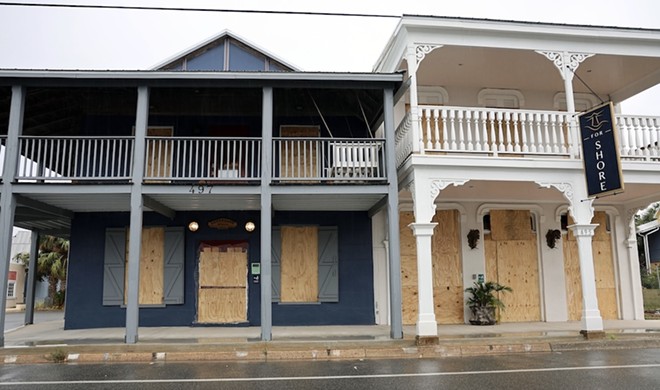 Store windows are boarded in Cedar Key in preparation for Hurricane Helene which is expected to make landfall as a Category 3 hurricane Thursday evening. (Azhalia Pottinger/WUFT News)