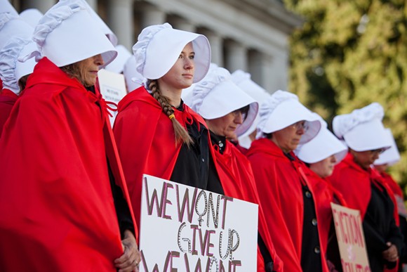 A scene from the 50 Handmaids in 50 States protest in Olympia, Washington - image via Crosscut