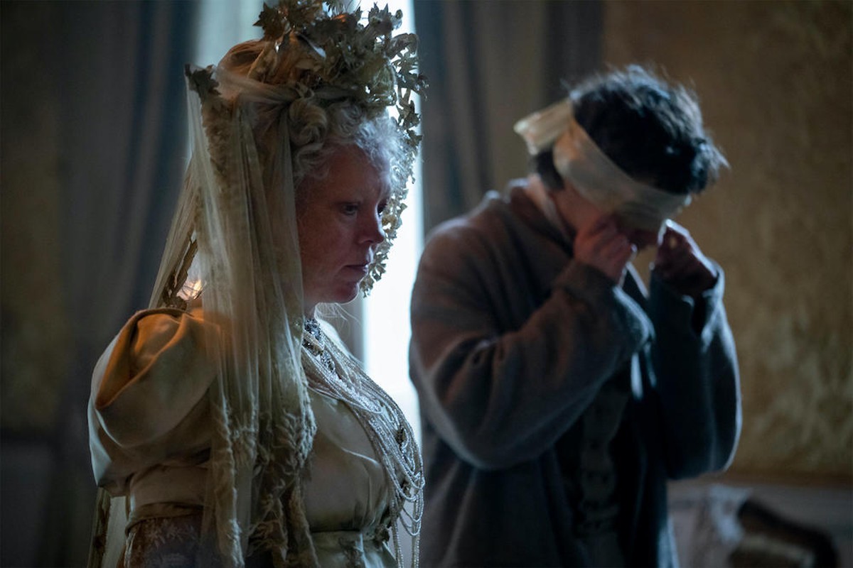 Olivia Colman as Miss Havisham and Fionn Whitehead as Pip in "Great Expectations"