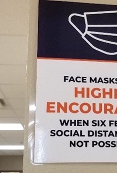 A sign at Eccleston Elementary School says masks are recommended, not required.