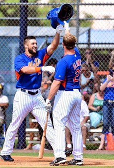 Tim Tebow autographs ball after throwing it into man's testicles
