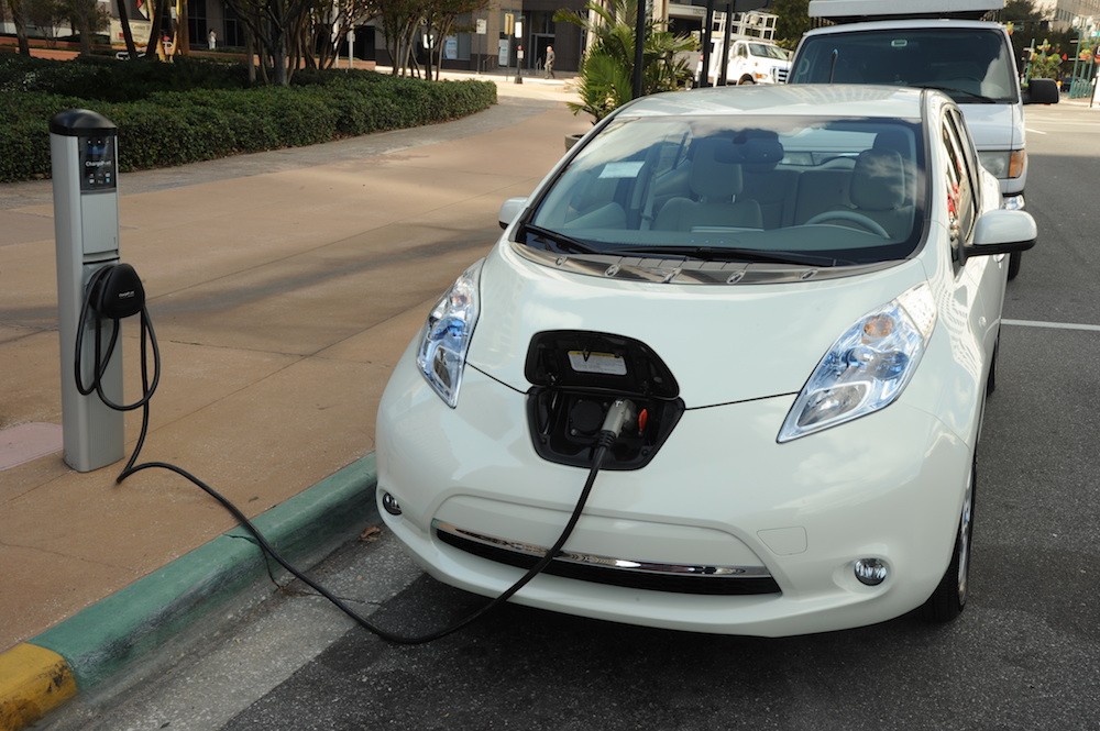 An electric vehicle charging station in front of  Orlando City Hall