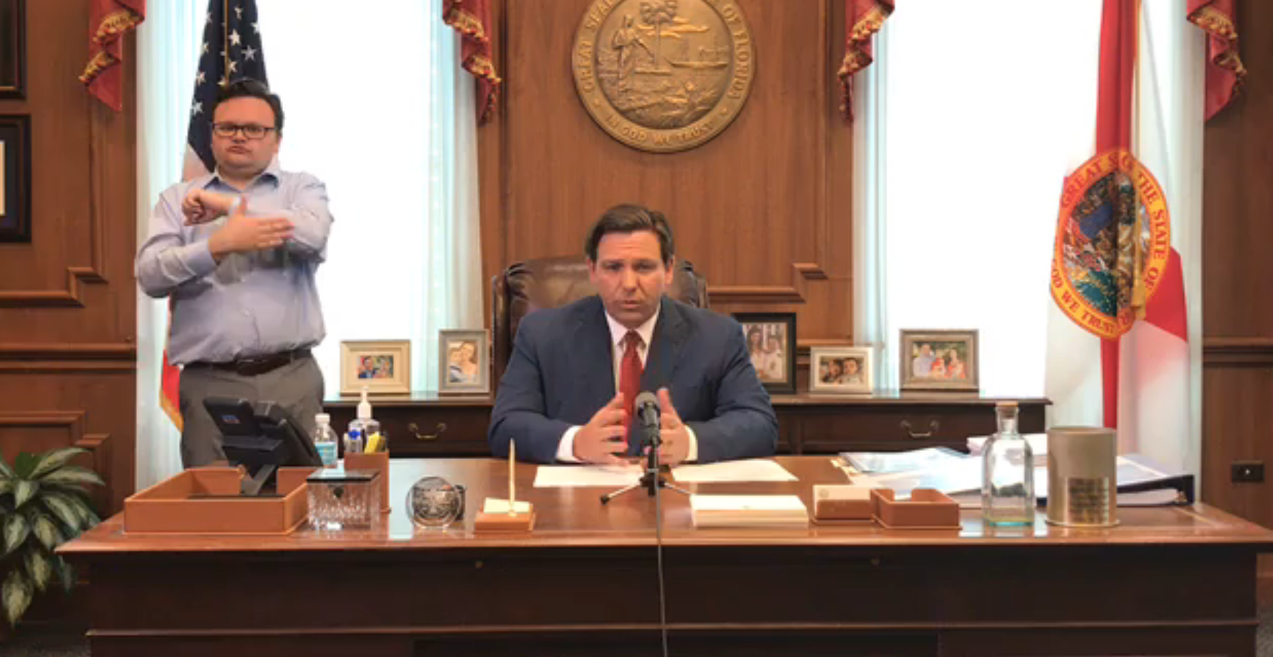 Florida Gov. Ron DeSantis signs a new executive order suspending