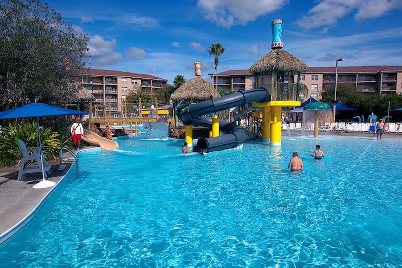 Liki Tiki Village in Winter Garden
17777 Bali Blvd., Winter Garden, 407-239-5000
Two heated pools, along with a Liki Tiki Lagoon, may sound pretty refreshing in this Florida heat. The lagoon is a 1.5-acre, 220,000-gallon area that combines a swimming pool with a water park. Unlike the ordinary swimming pool, Liki Tiki offers a rolling wave pool, five water slides, an erupting water volcano, a waterfall and a dancing fountain. And if you want a break from fun in the sun, visit the lounging areas or Shipwreck Sally&#146;s Bar and Grill. If you are staying as a guest or have made a reservation, you are allowed to use the pool at the resort. Depending on the number of guests staying at the hotel, a certain number of additional guests are welcome to use the pool area as well, but they are asked to bring their own towels. The Liki Tiki Lagoon is open from 10 a.m. to 7 p.m., and the two heated pools are open from 7 a.m. to midnight. 
Photo via Liki Tiki Village