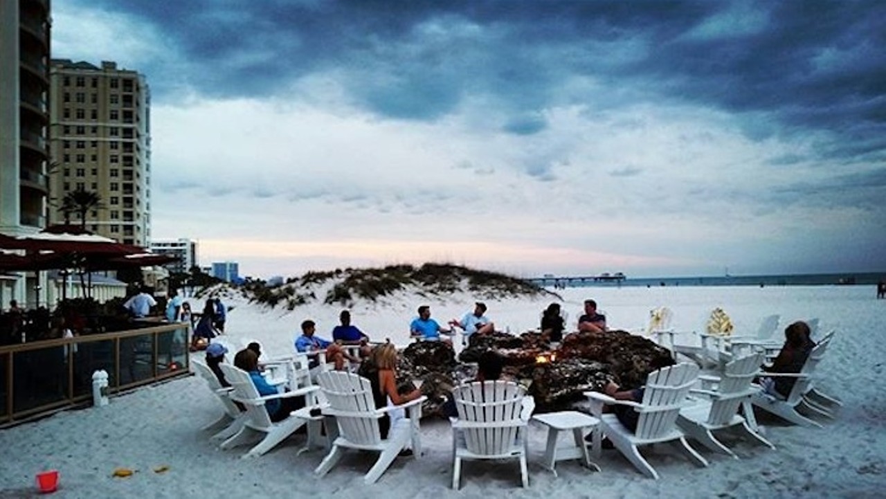 Tate Island Grill
500 Mandalay Ave., Clearwater Beach | 727-674-4171
Distance from Orlando: 2 hours, 3 minutes
After chowing down on a fresh salad or beefy burger, take your cocktail down to the beach to enjoy the sunset and some live music by the beachside fire pit. 
Photo via hellobeautifuljourney/Instagram