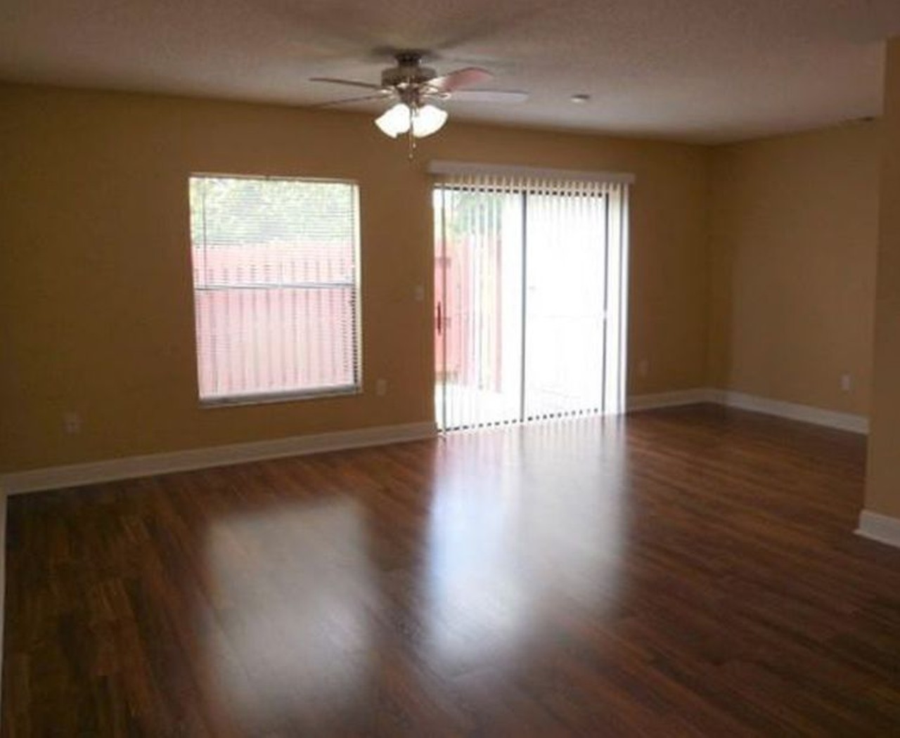 6229 Yorktown Dr, Orlando
$1,200/mo
2 bed, 2.5 bath, 1,227 sqft
This is an awesome living room area with the wood floors and axis to the the outdoor, patio area.