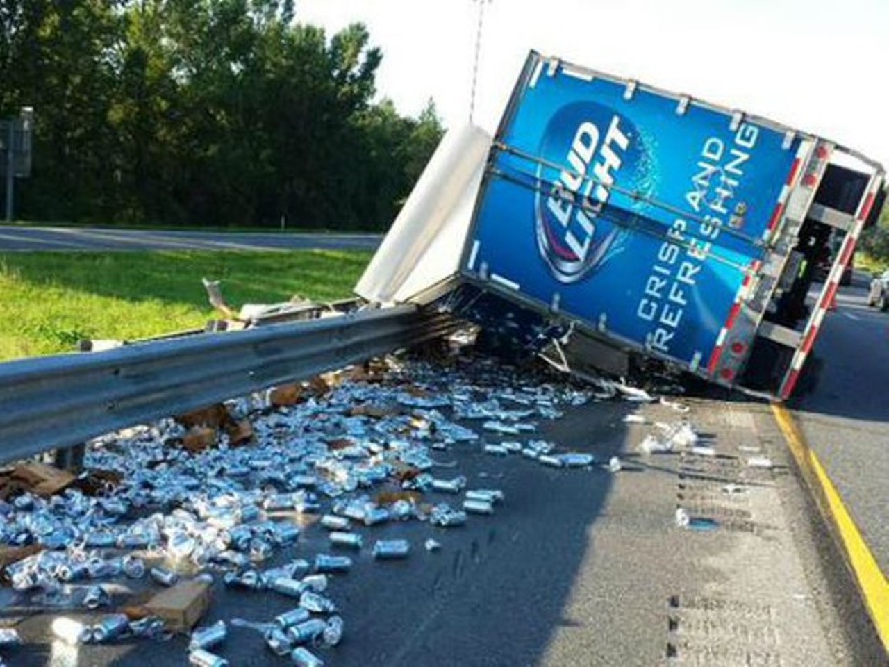 You could crash your semi-truck, spilling  thousands of Bud Lights on the highway, because you were petting your dog. 
Photo via WFTS