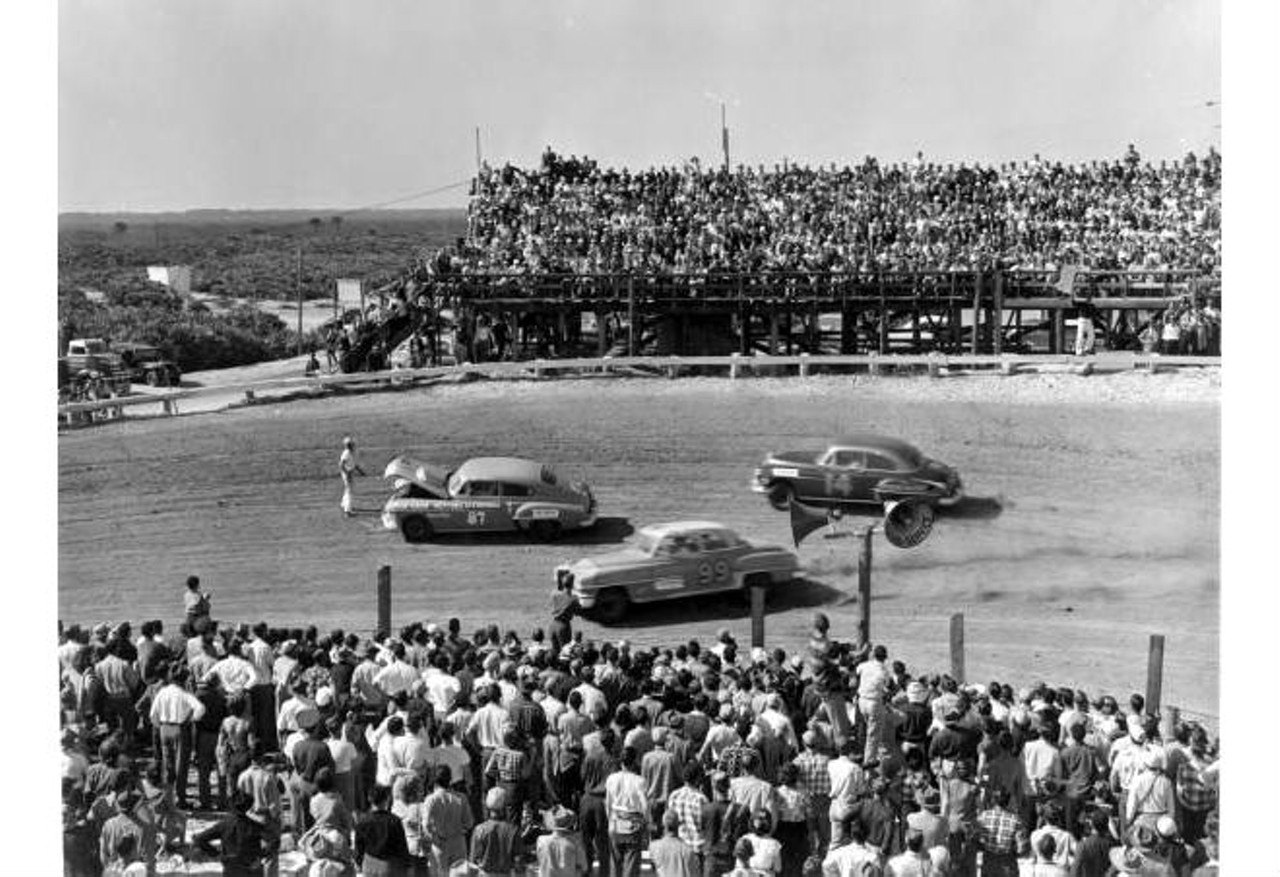 Crowds watching an automobile race
